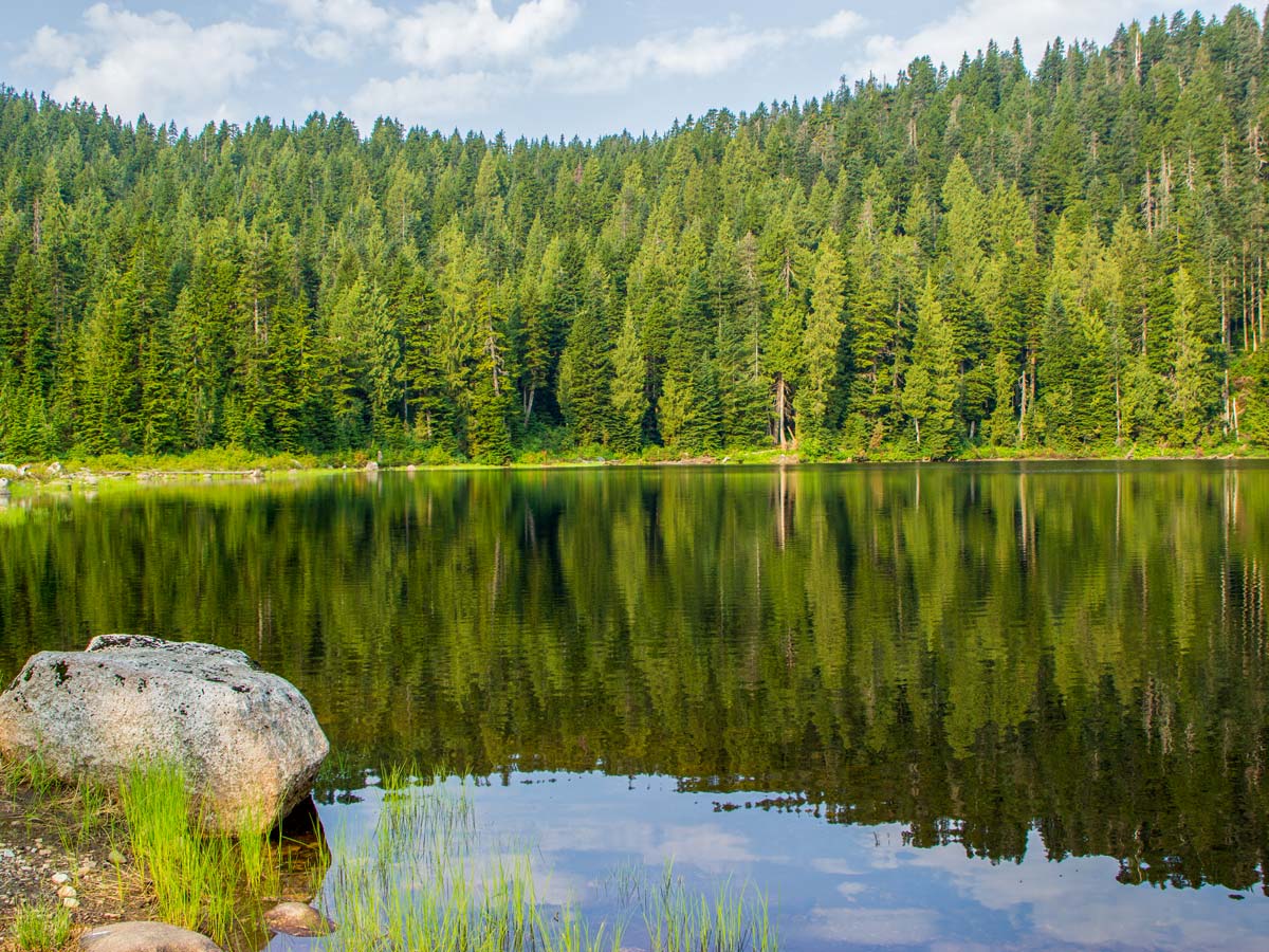 Reflections in Dennett Lake waters along Munro Lake hike near Vancouver