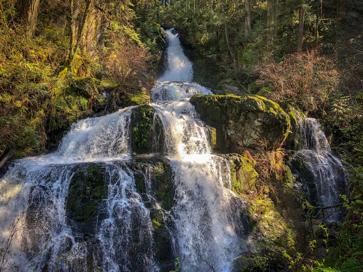 Sunny Steelhead Falls waterfalls east of Vancouver on forest hiking trail