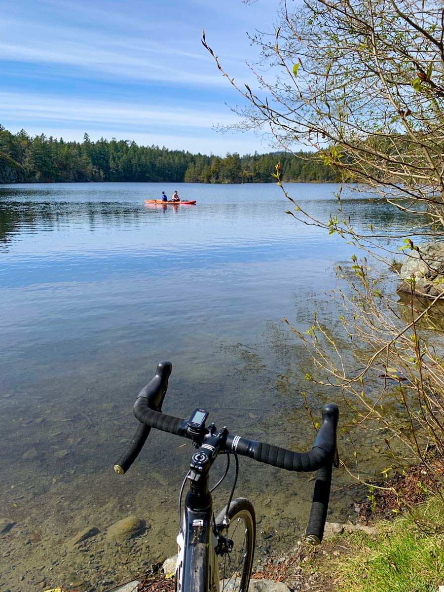 Kayaks on Thetis Lake seen biking from Galloping Goose near Victoria