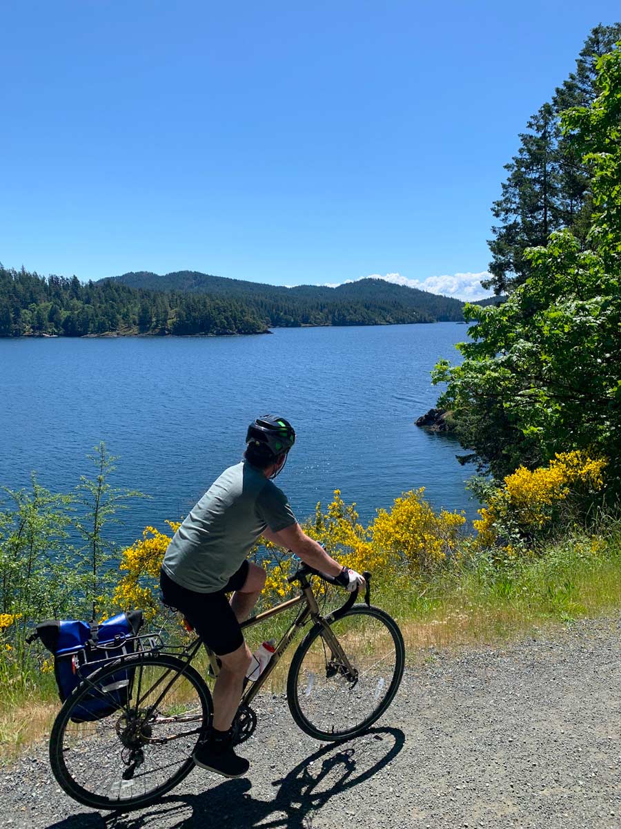 Biking alongside the Pacific Ocean on Goose to Sooke Potholes bike trail near Victoria