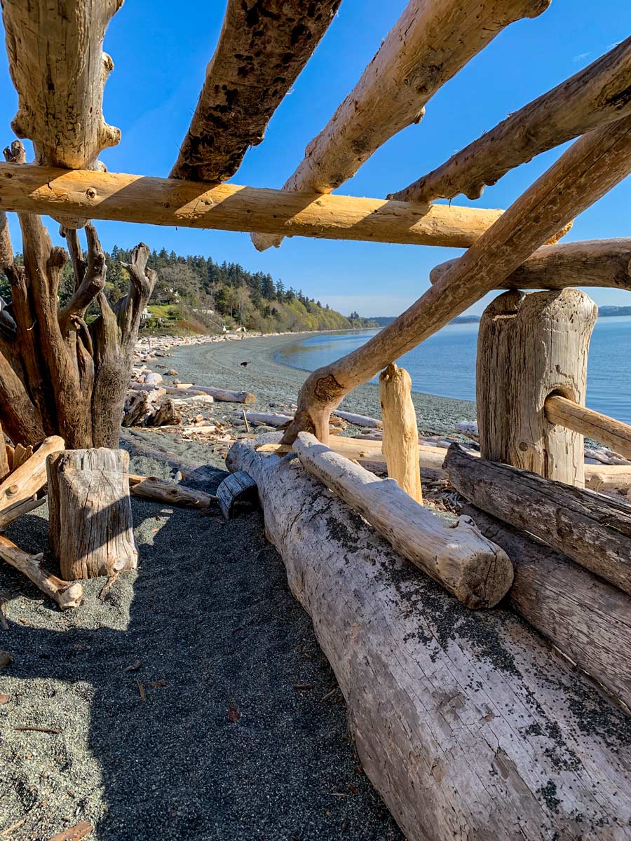 Driftwood shelter on the beach along Metchosin Loop biking near Victoria BC