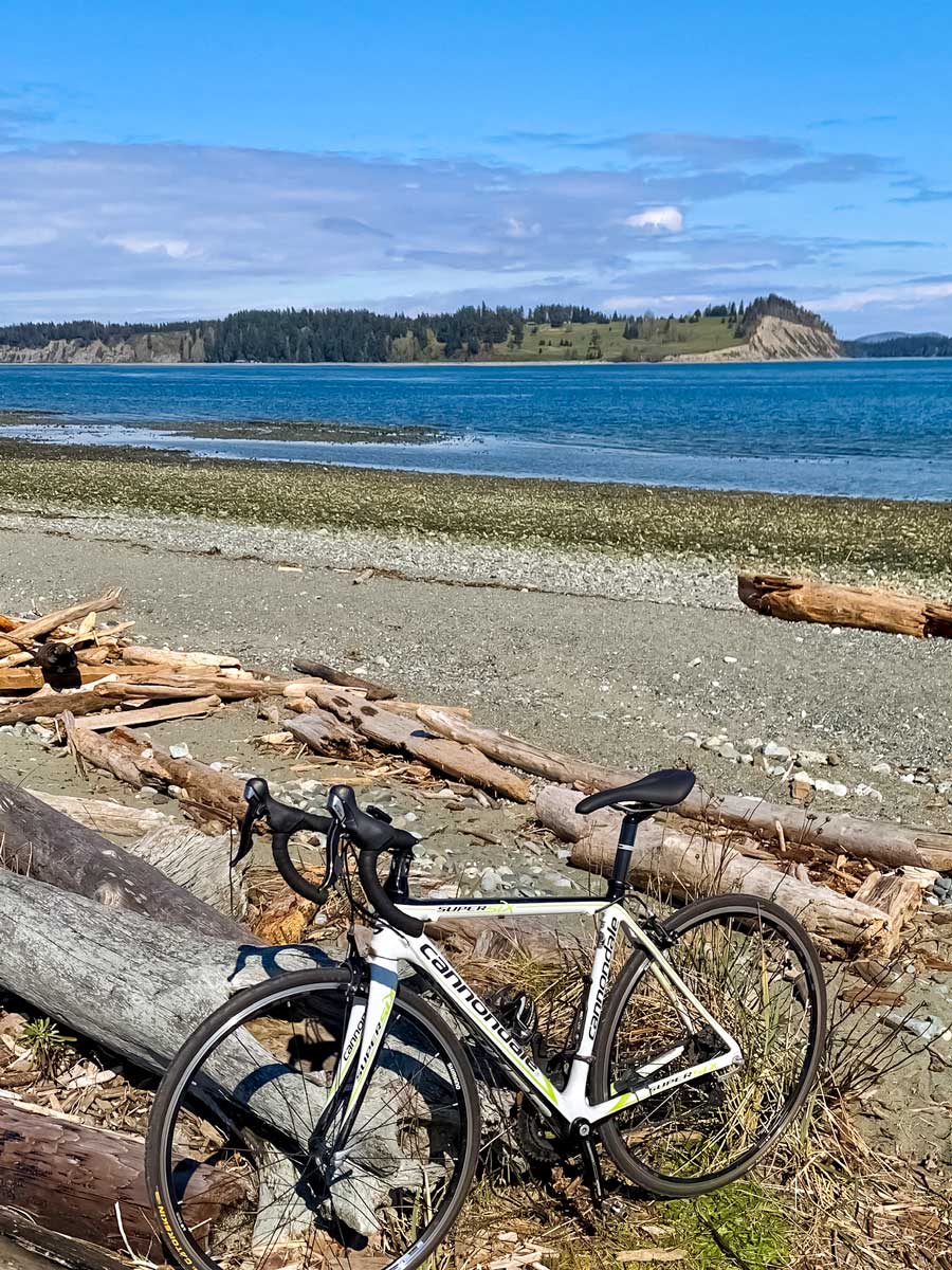 Bike break by the Pacific along Peninsula Loop trail biking near Victoria BC