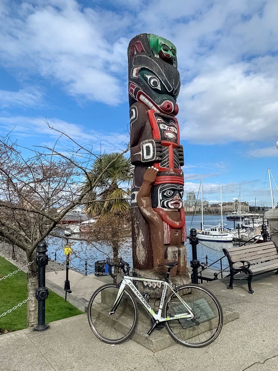 Bike and totem pole along Seaside Loop biking trail in Victoria BC