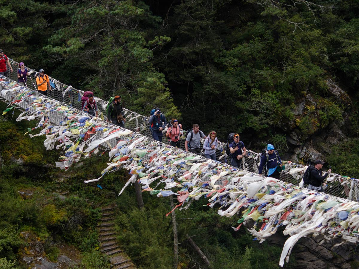 Group of hikers on the bridge (Three Passes Trek, Nepal)