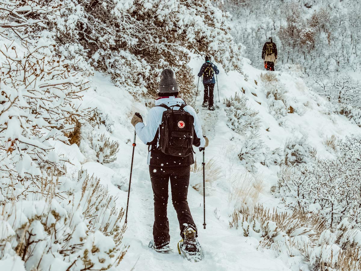 Beautiful trail snowshoeing through deep snow in Utah winter near Salt Lake City SLC