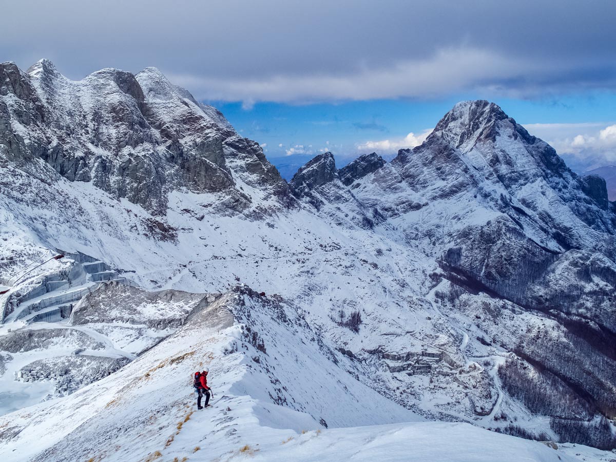 Hiking mountaineering in Italy snow on mountains Italian adventure