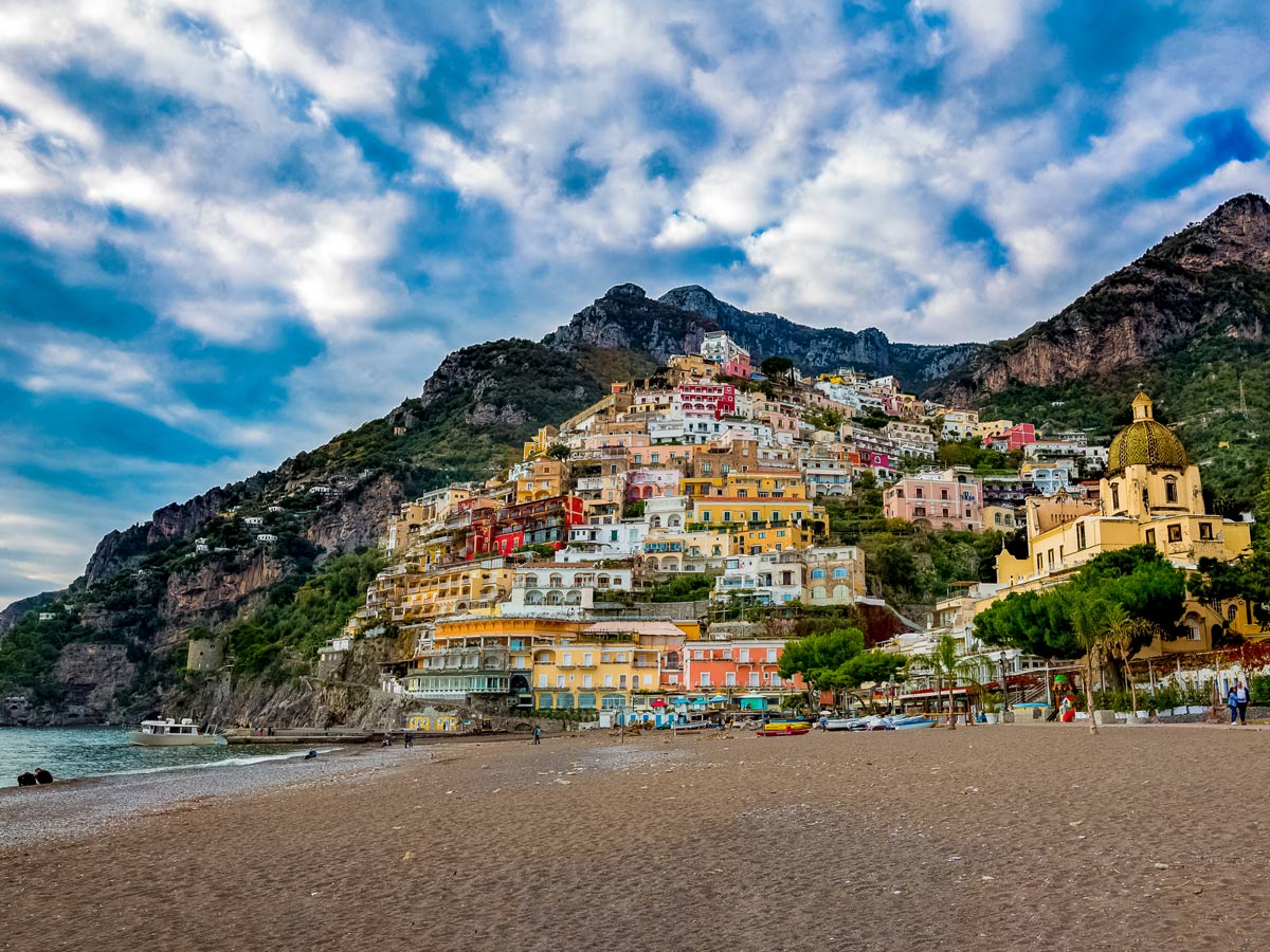 Coastal mountainside italian town by the ocean colourful houses italy