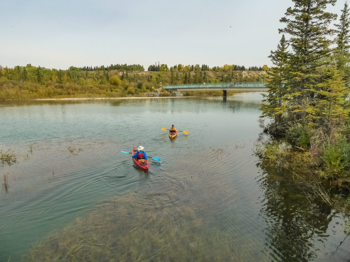 Kayakers seen paddling along Weaselhead Flats trail hiking in Calgary