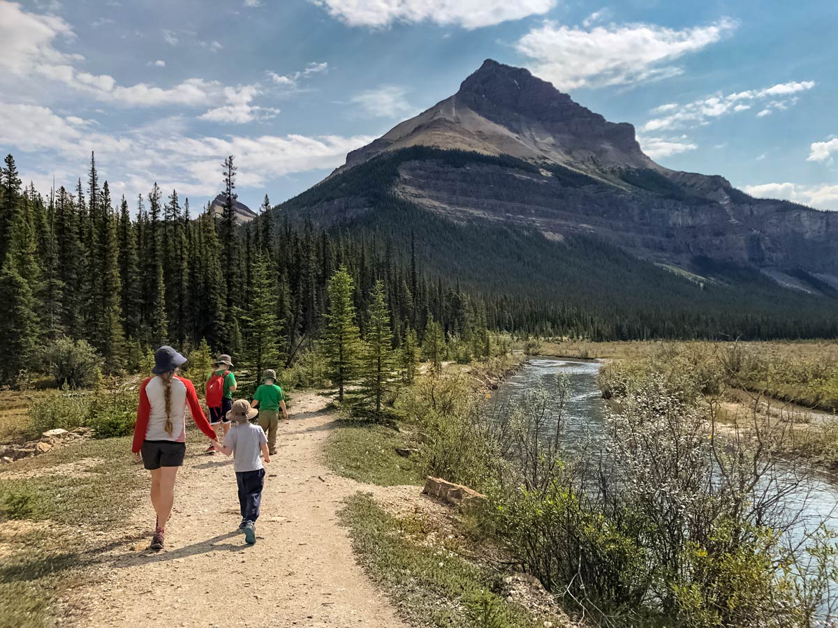Family begins hiking to Beauty Creek in Jasper National Park Canada