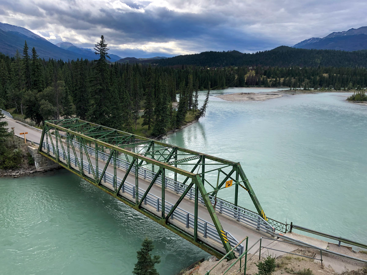 Beautiful bridge crossing turquoise blue river Old Fort Hill Jasper Alberta Canada