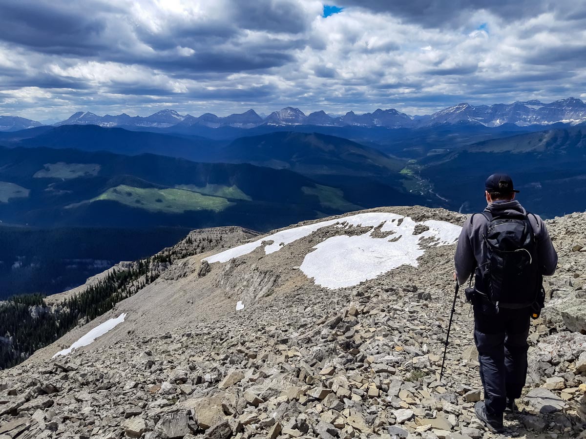 Hiker summits Mt Burke in Kananaskis Alberta