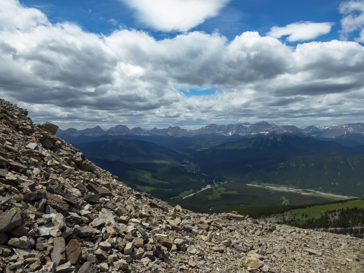 Hiking scrambling scree climbing above Kananskis Country up Mount Burke