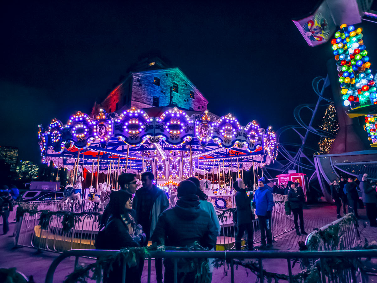 Toronto Christmas Market outdoor winter carnival carousel in Toronto Canada