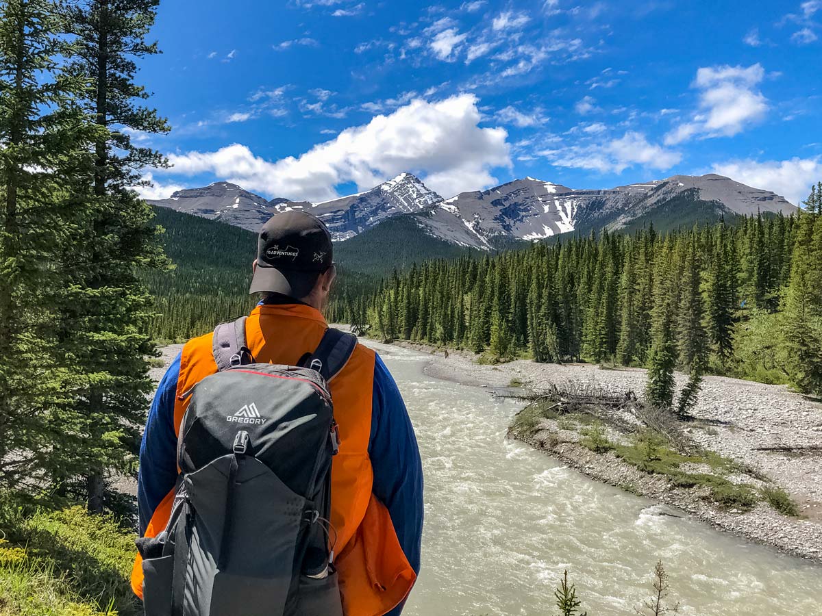 10Avdentures hiker looks to Rocky Moutnains along Little Elbow trail Kananaskis Alberta