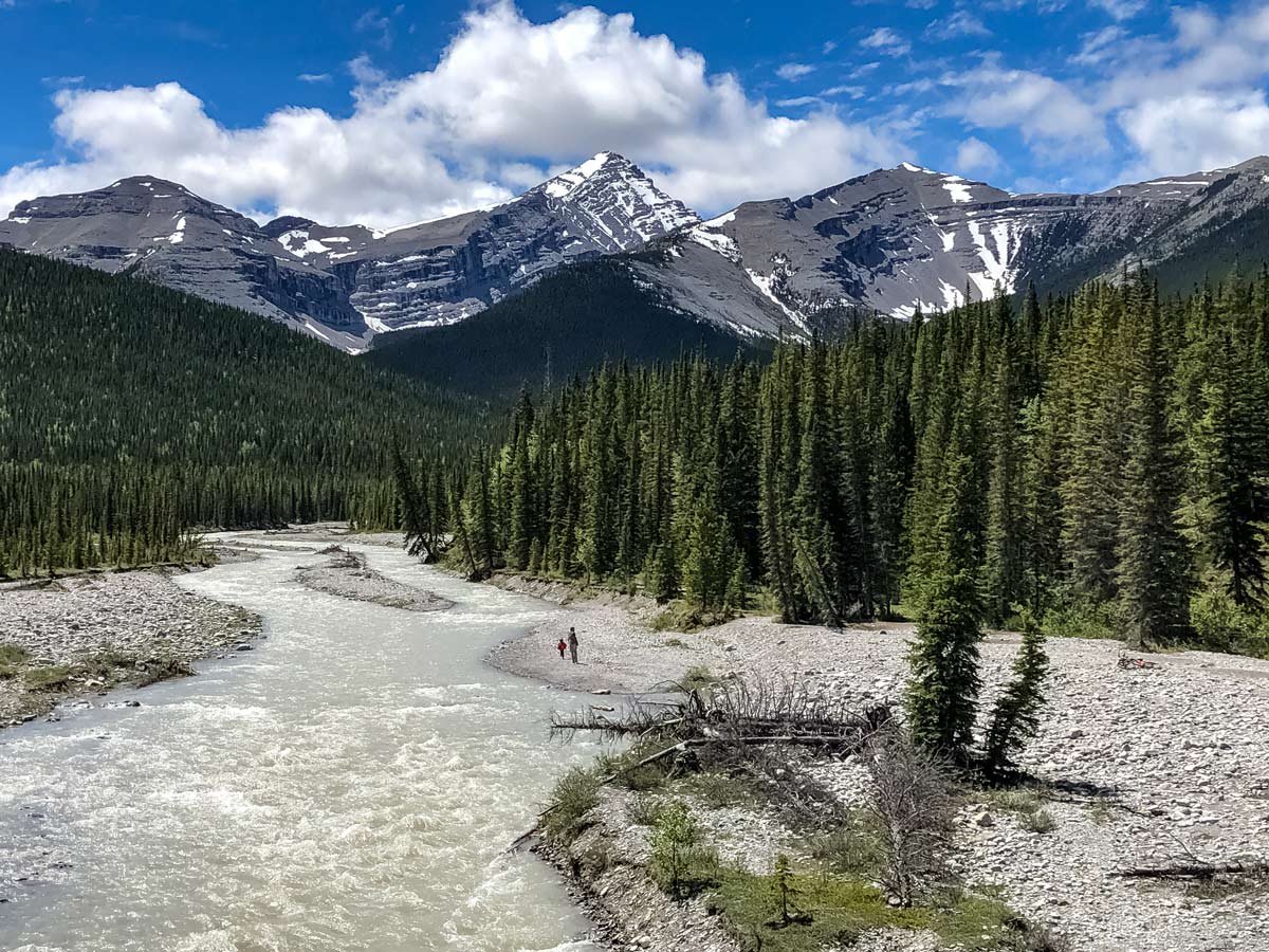 Hikers exploring by the river Little Elbow hiking trail Kananaskis Alberta Canada