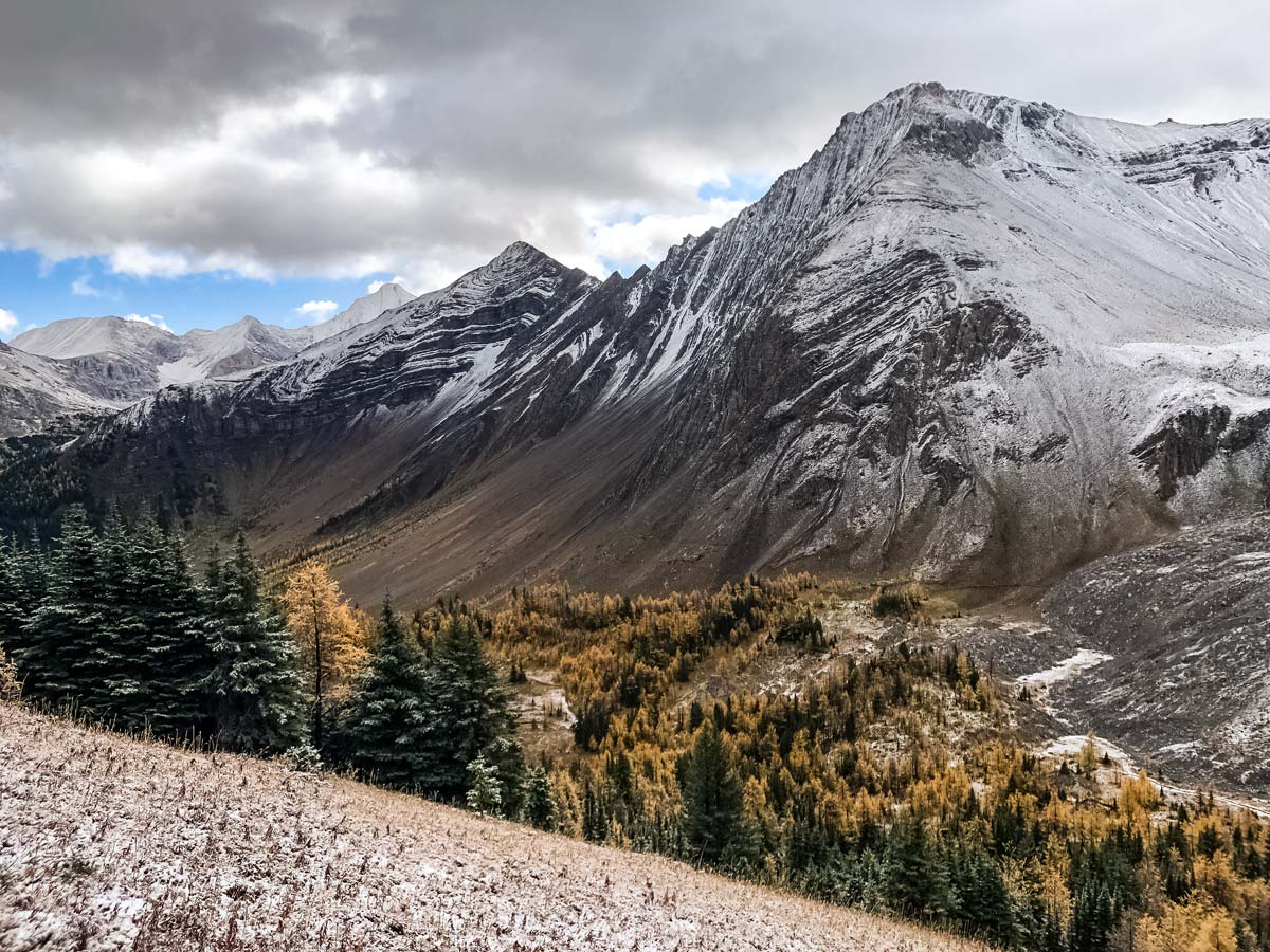 Snow on rocky mountains hiking Pocaterra Cirque hiking trail in Kananaskis Alberta Canada