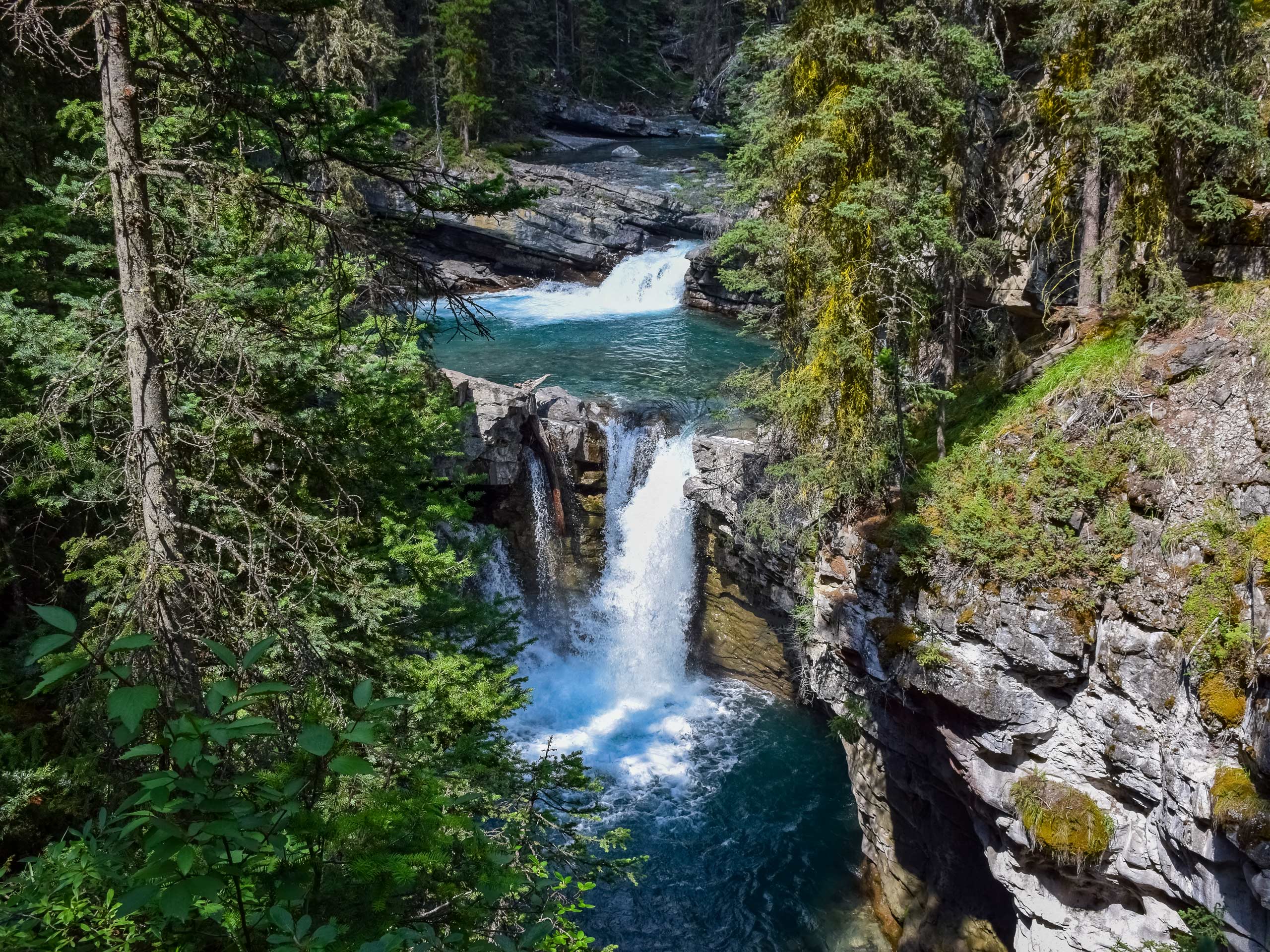 Forest waterfalls hiking Johnston Cayon to Ink Pots Banff National Park