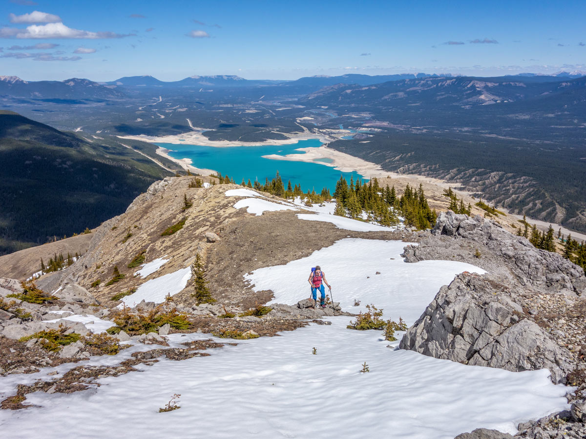 Hiking during spring on Windy Point Ridge Hike with Abraham Lake in the background