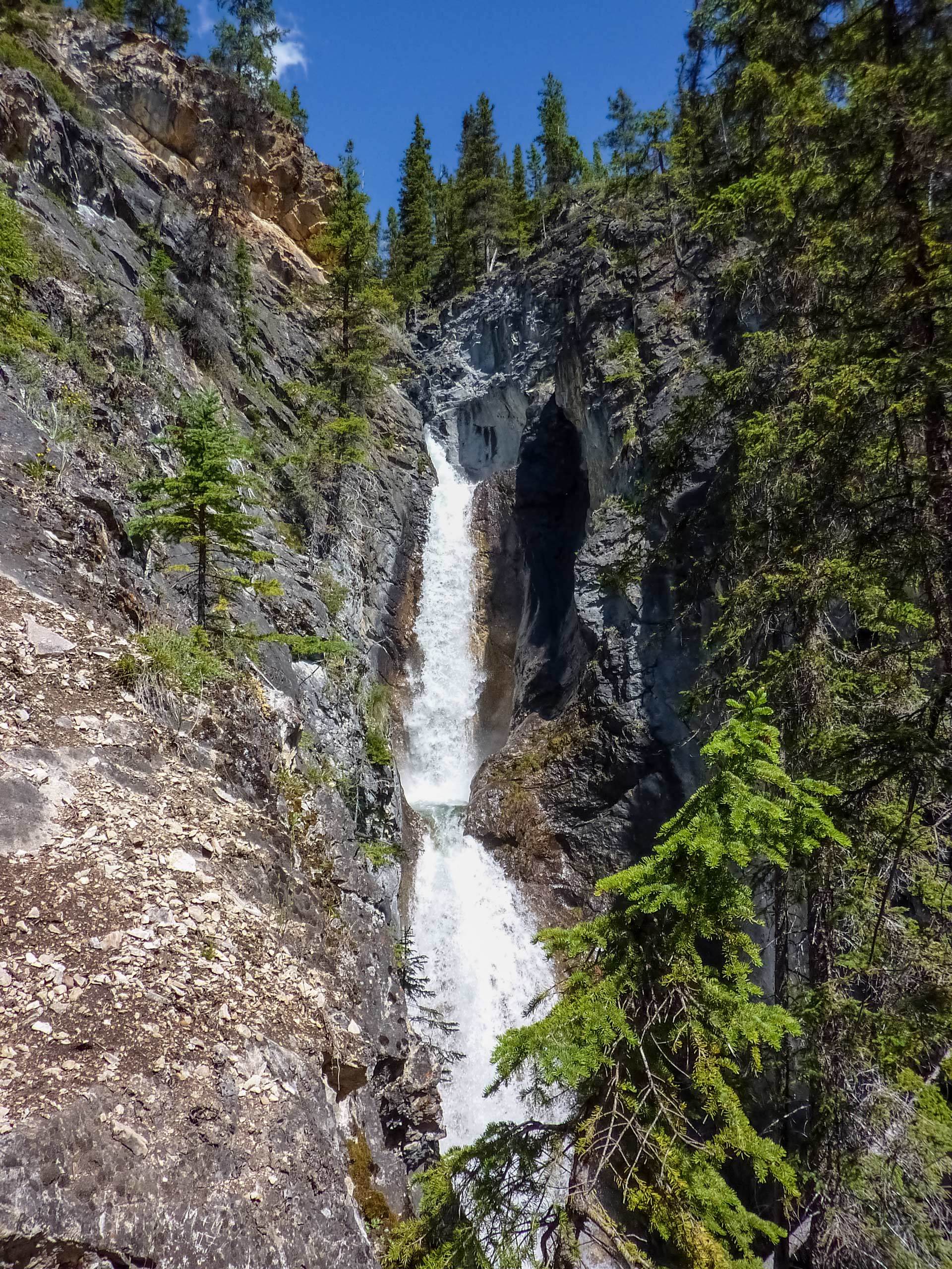 View looking up at tiered waterfalls Silverton Fall hiking Banff National Park