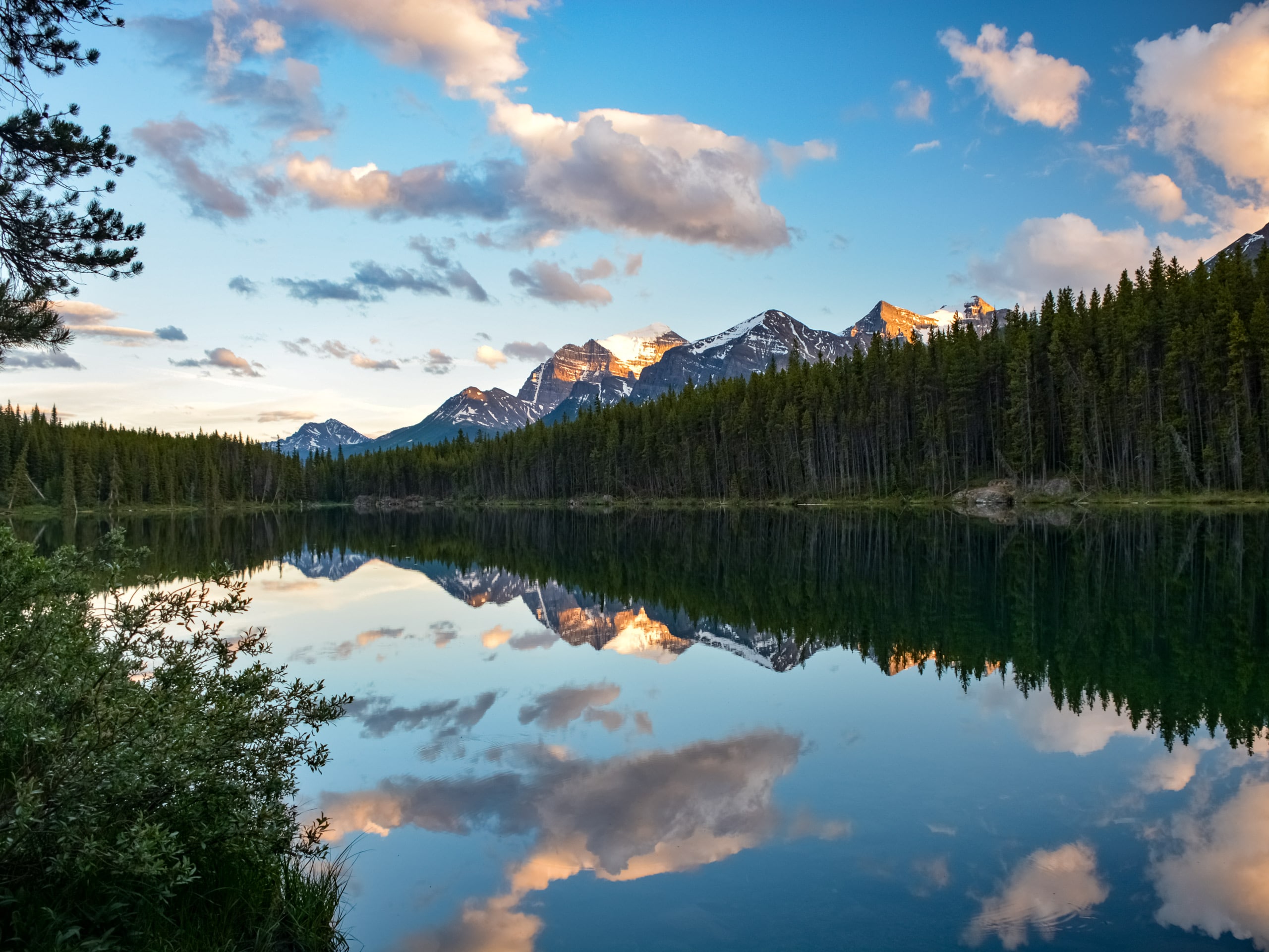 Sun on the Rocky Mountains behind Herbert Lake Banff National Park