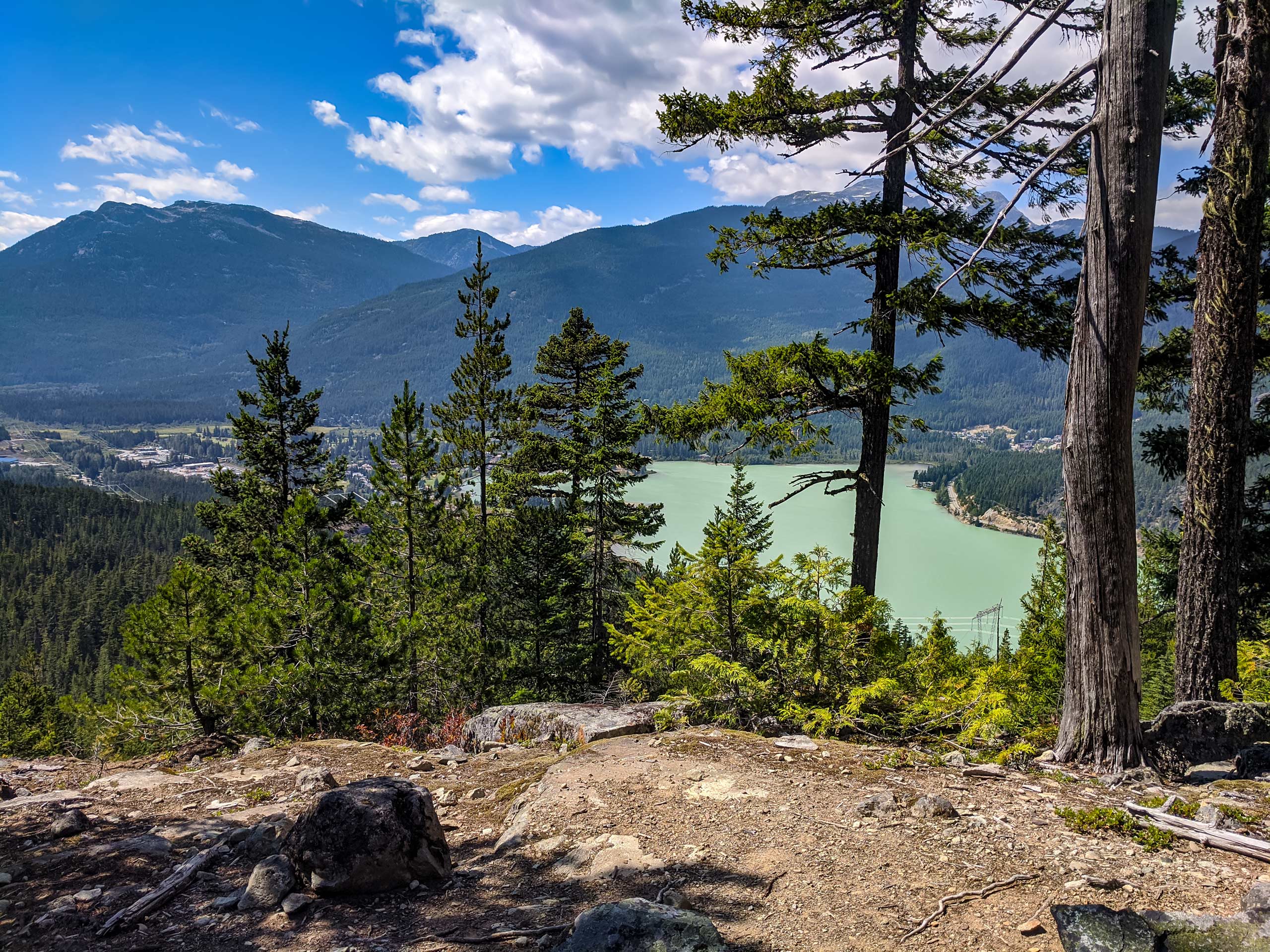 View of lake and town below hiking Comfortably Numb trail Whistler