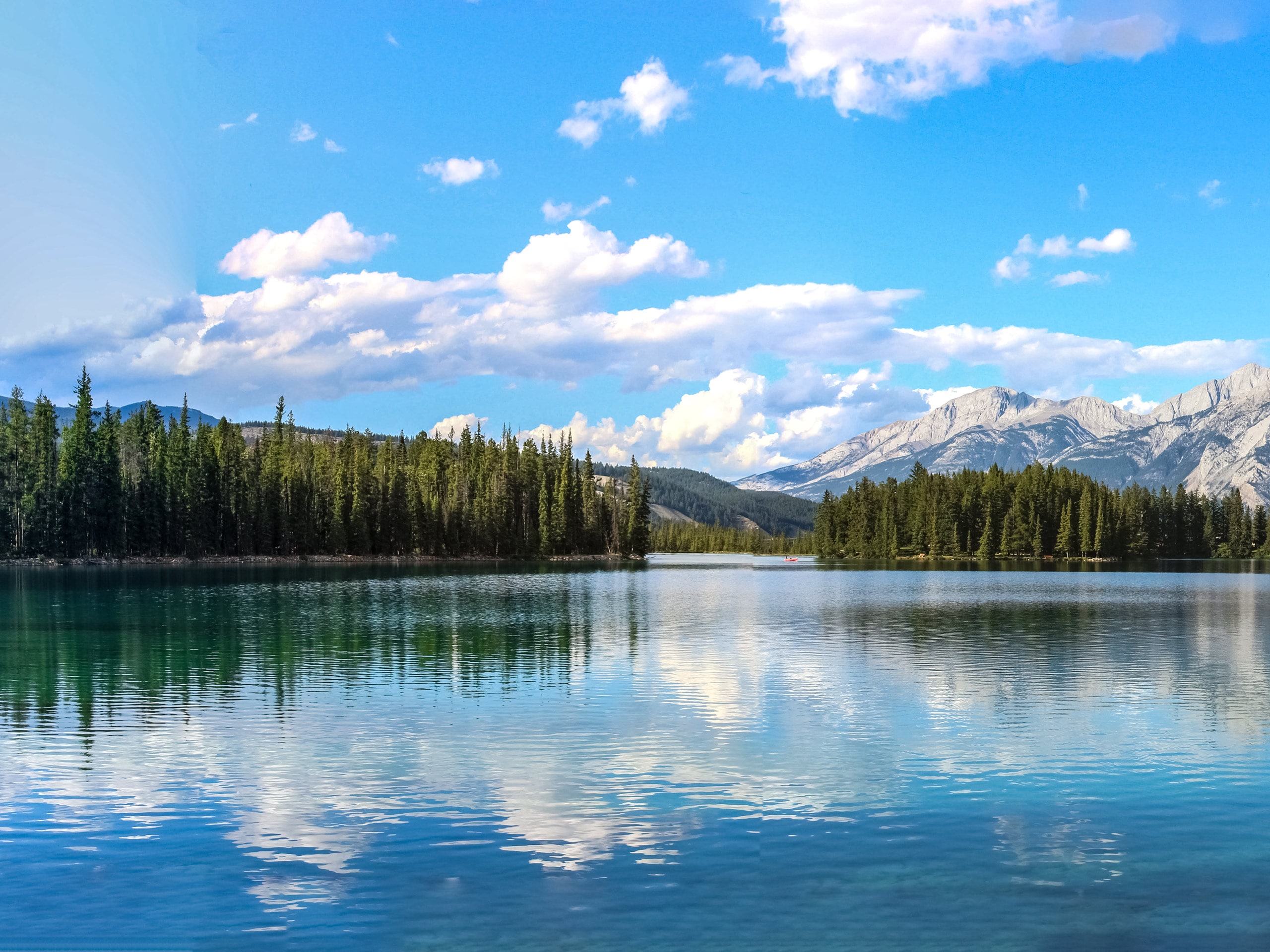 Calm Beauvert Lake in the Canadian Rockies hiking Jasper National Park