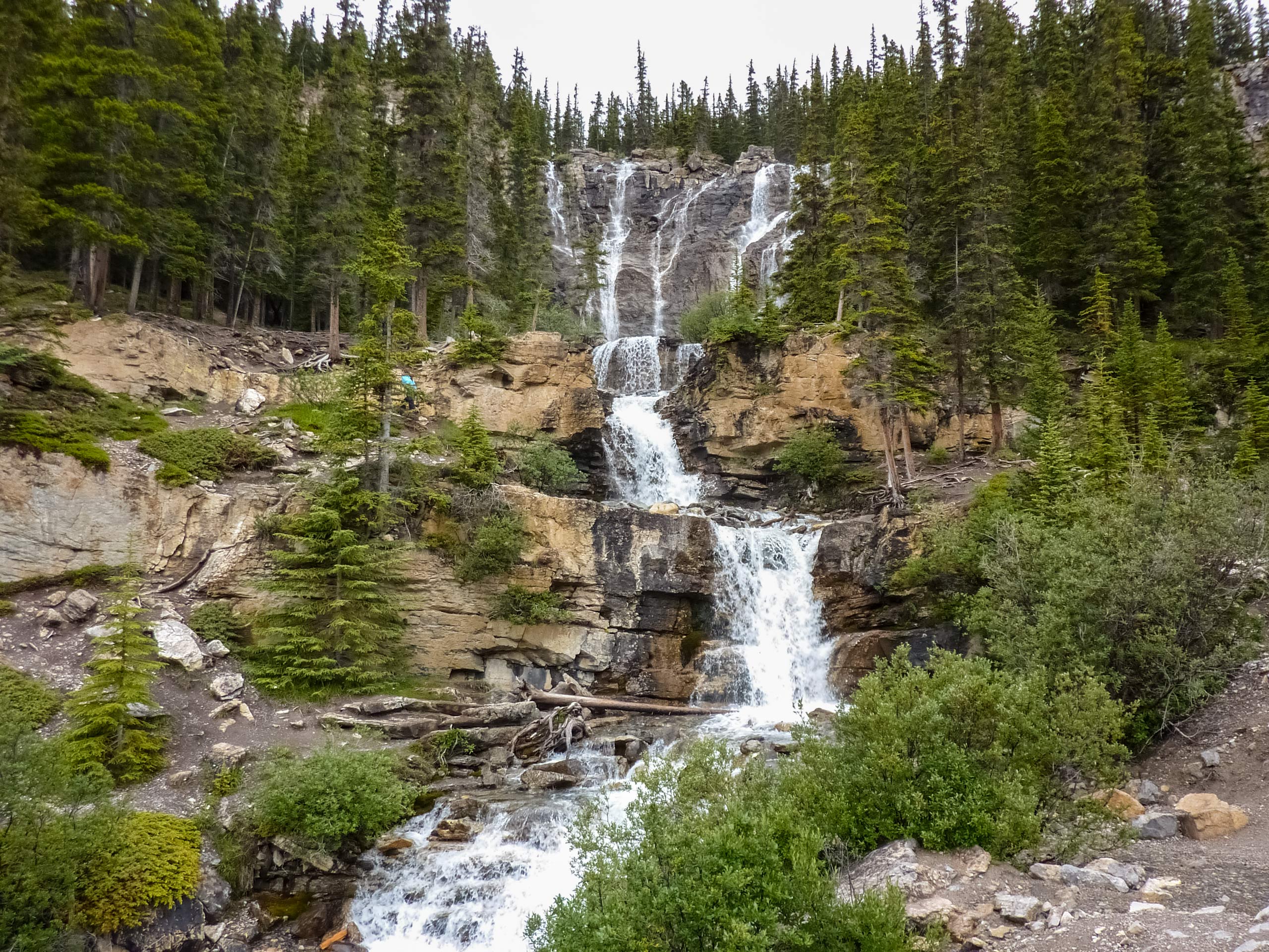 Cascading Stanley Falls waterfalls down rock cliffs hiking Jasper National Park
