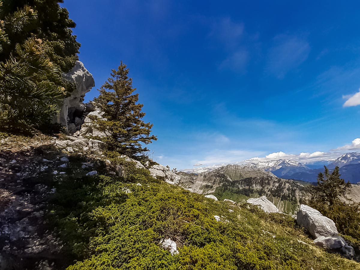 rocky descent with wider view 3 tetes Plateau des Gileres hiking France