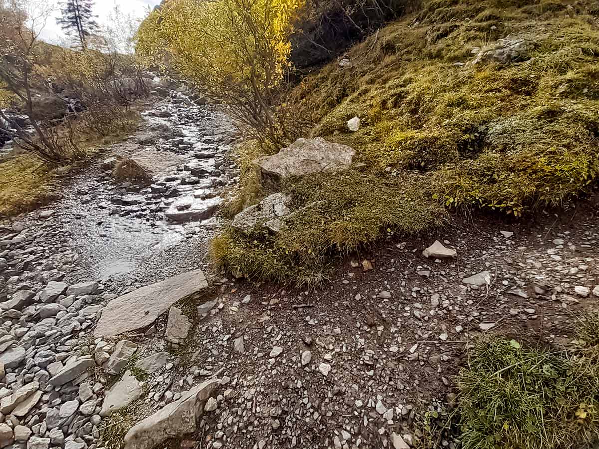 Stream next to pathCol Des Aravis hiking trails in France