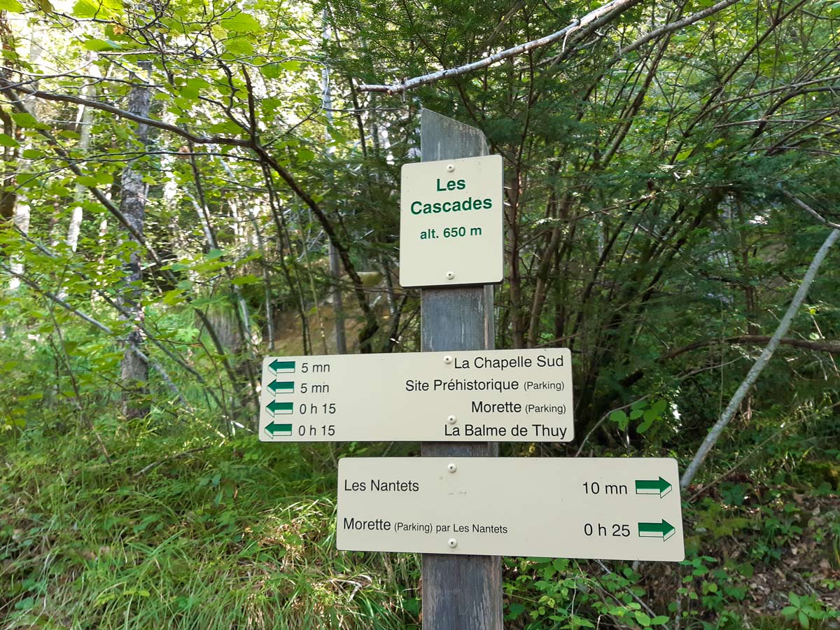 Signpost at waterfall hiking Morette Falls trail France