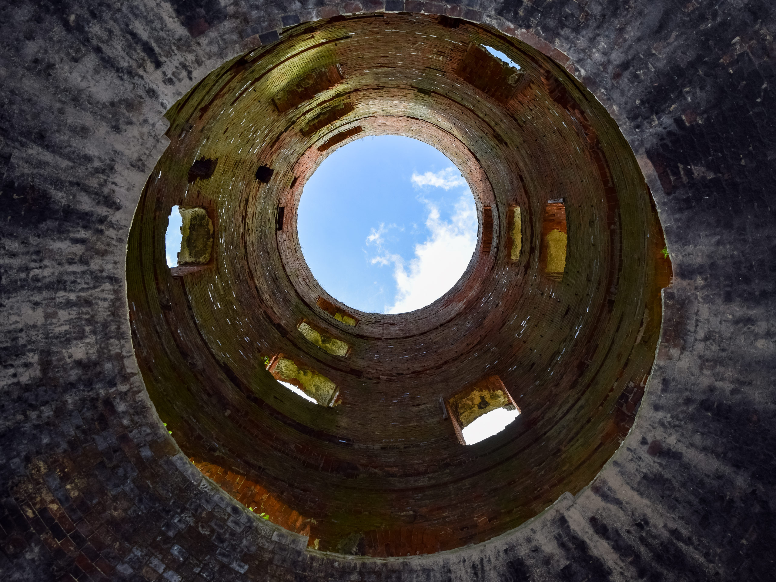Looking up at the sky from inside Racton Ruins walking route South Downs UK