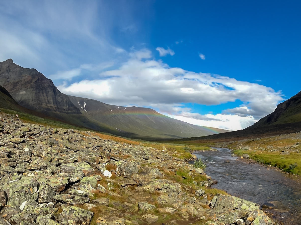 Rainbow over Swedish Lapland valley Sweden