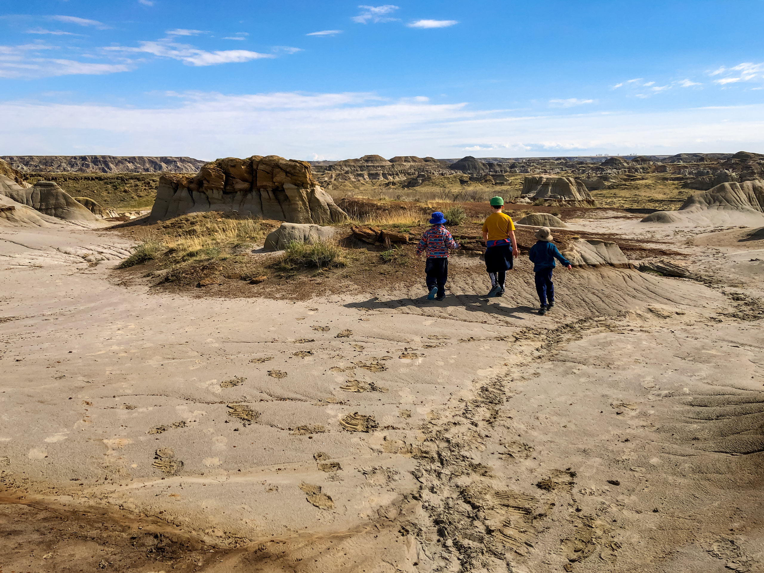 Kids walking along Coulee Viewpoint Dinosaur Provincial Park Alberta