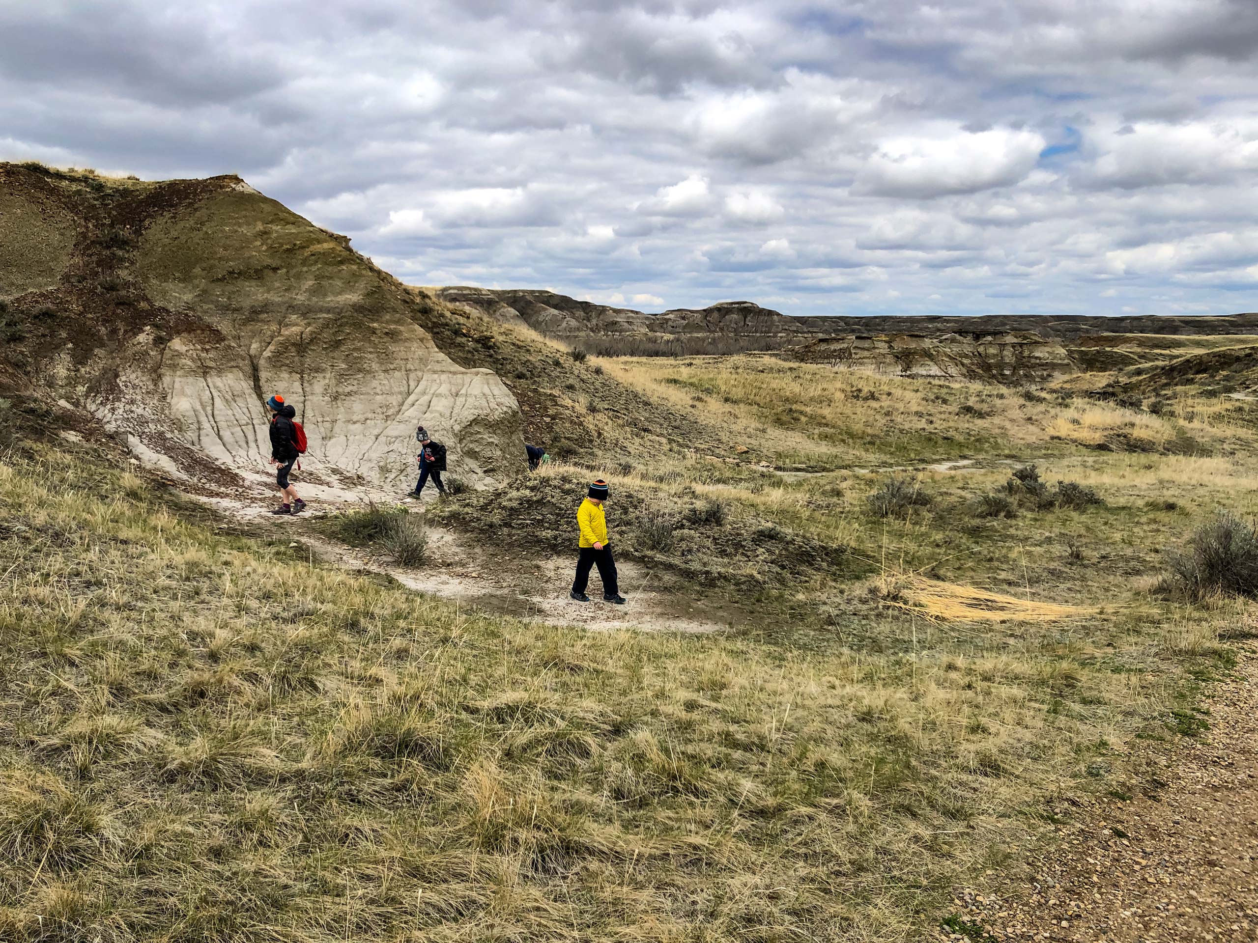 Family exploring Trail of the Fossil Hunters in Dinosaur Provincial Park Alberta