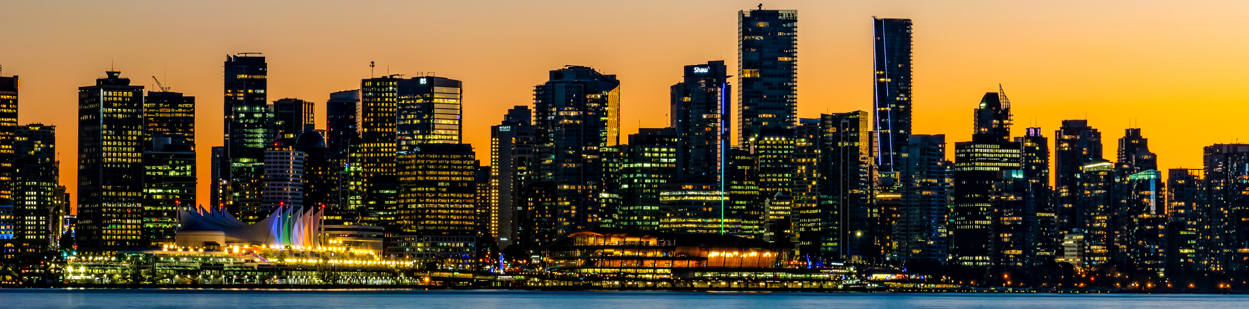 View of Vancouver skyline at sunset from Lonsdale Quay Market along the Spirit Trail