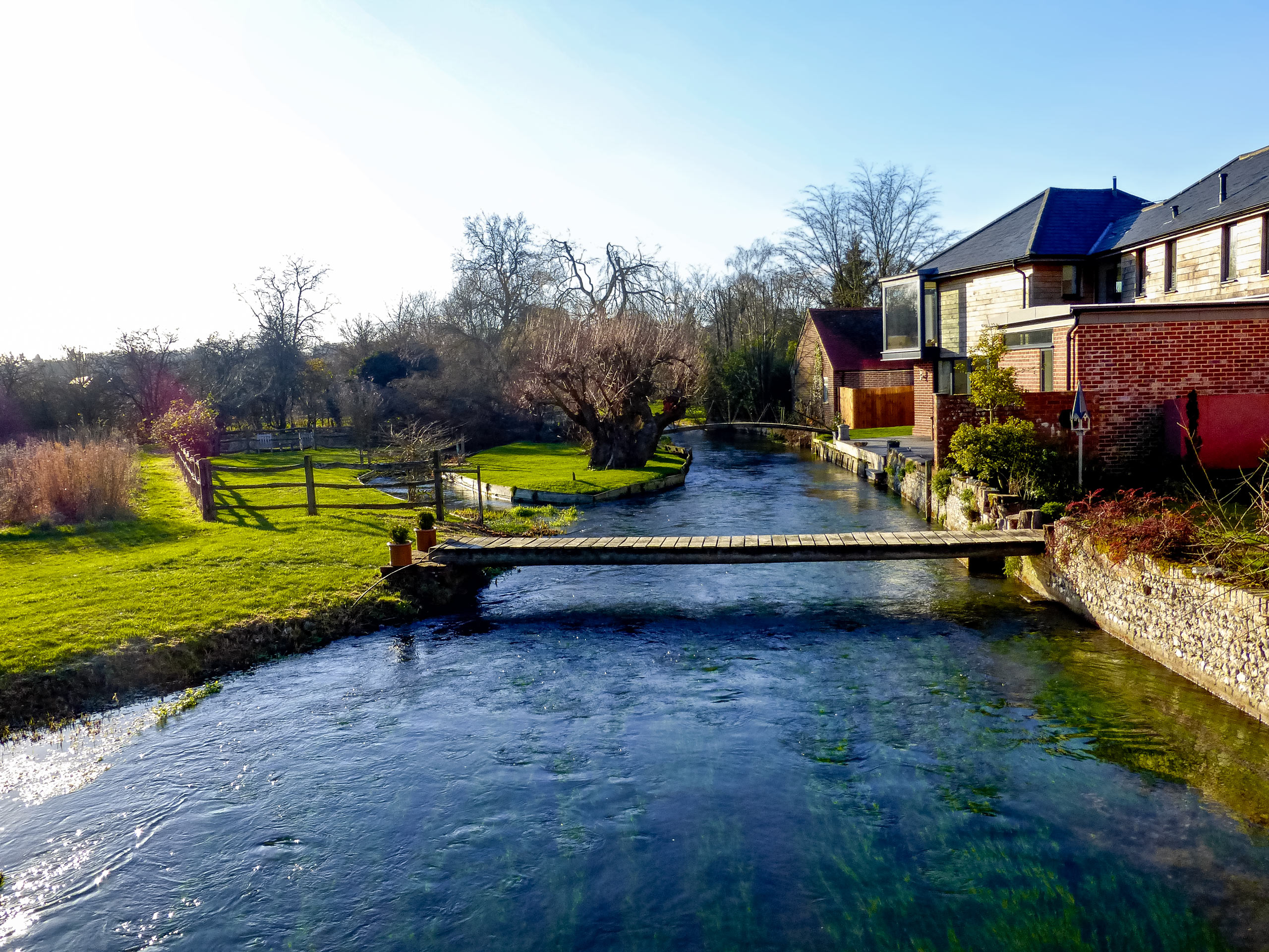 Foot bridge crossing small river in Exton Buriton UK