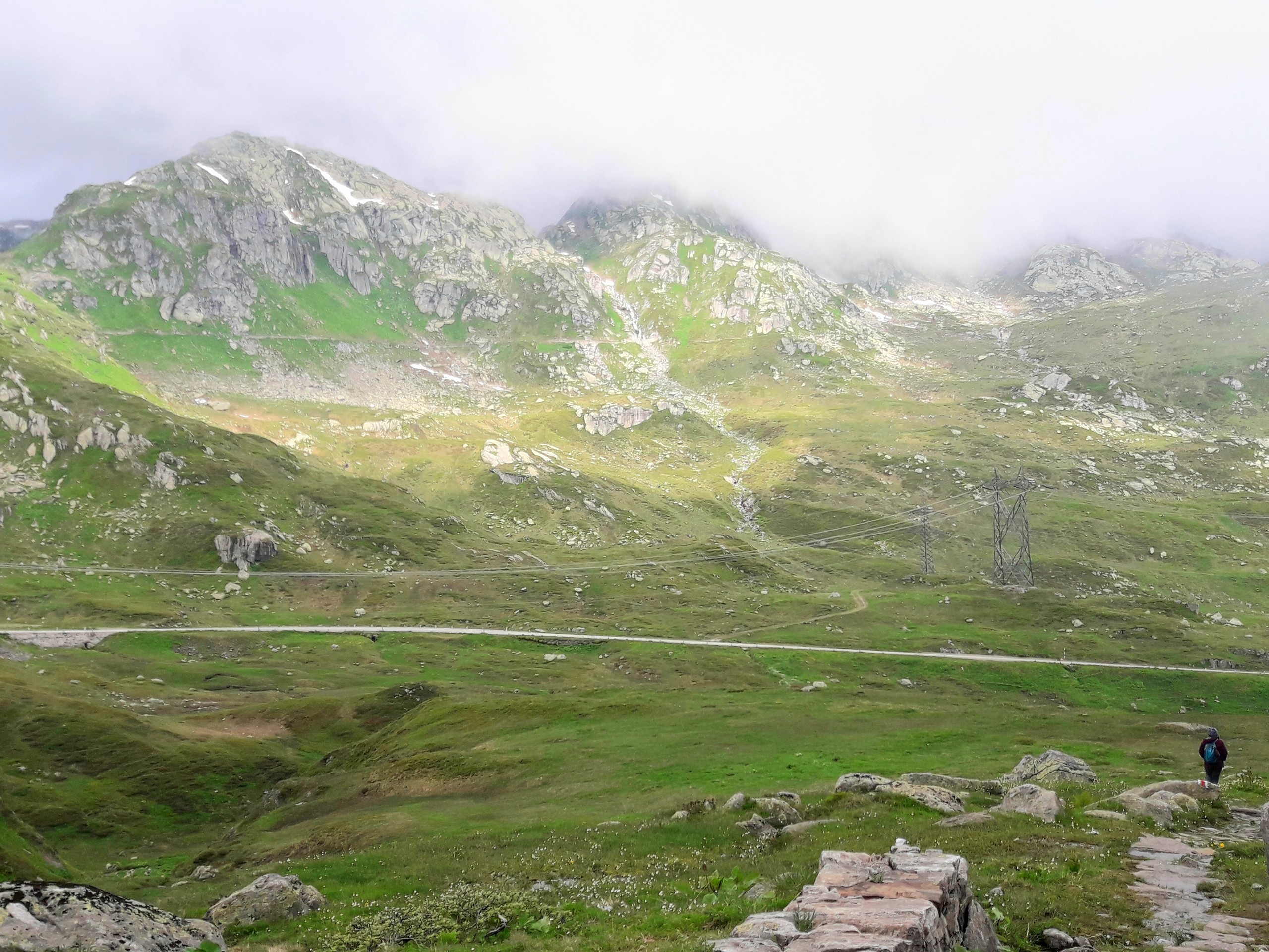 Green meadow along the path from Passo del Gothardo to Hospental