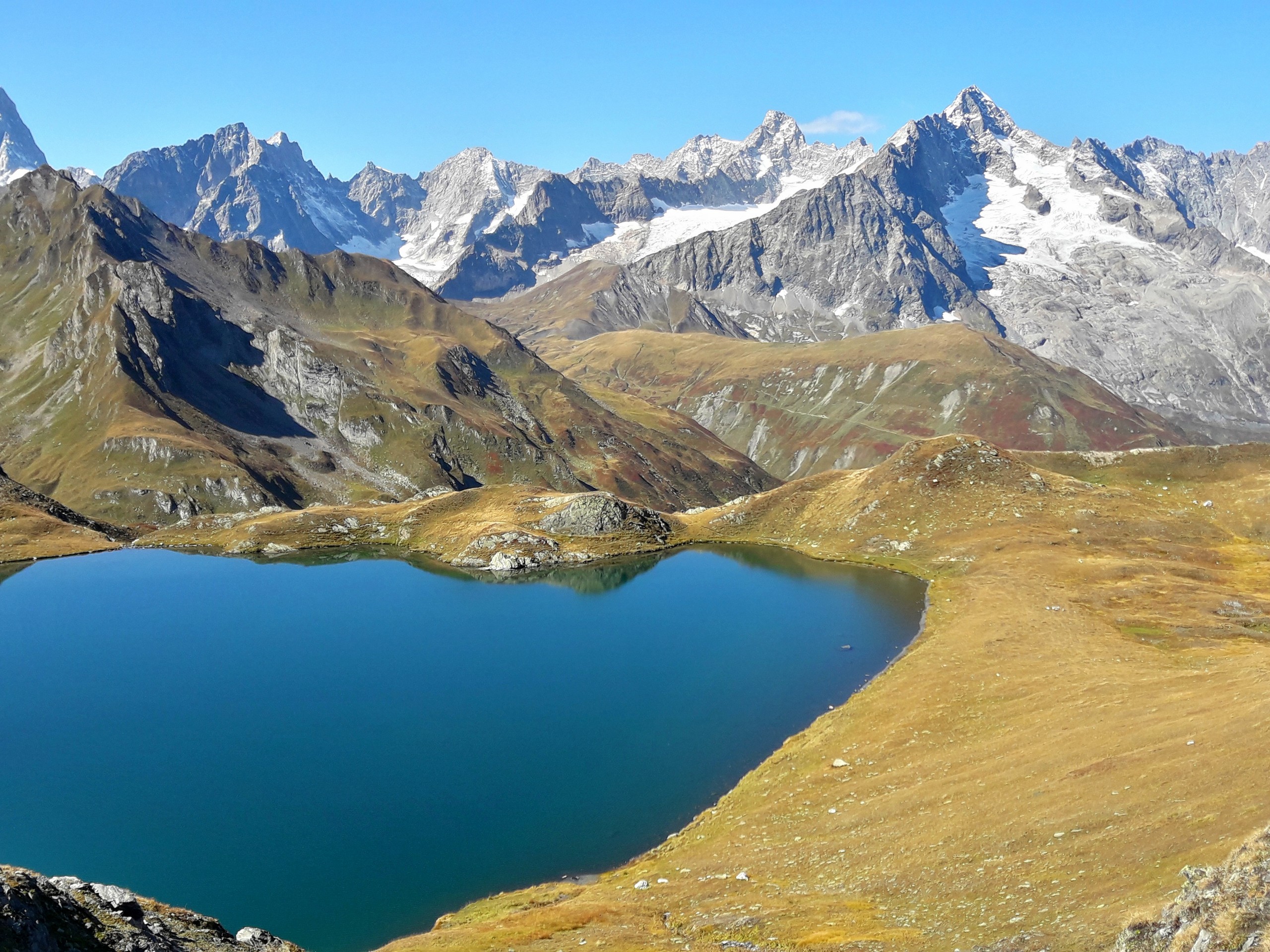 Looking at the blue lake, seen along the trial in Swiss Alps