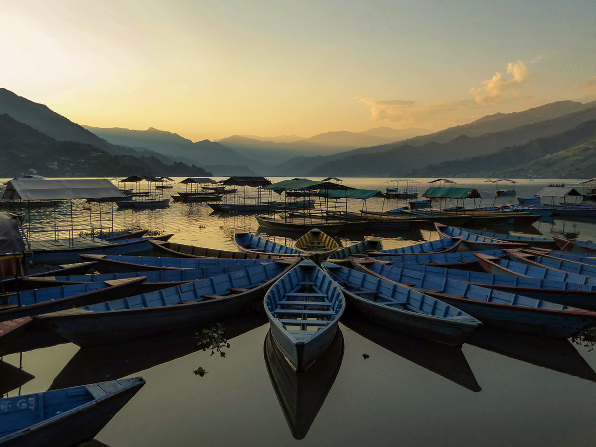 Pokhara harbour boat docks at sunset in Nepal
