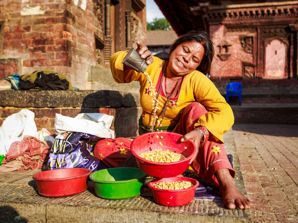 Smiling local woman in Kathmandu market Nepal