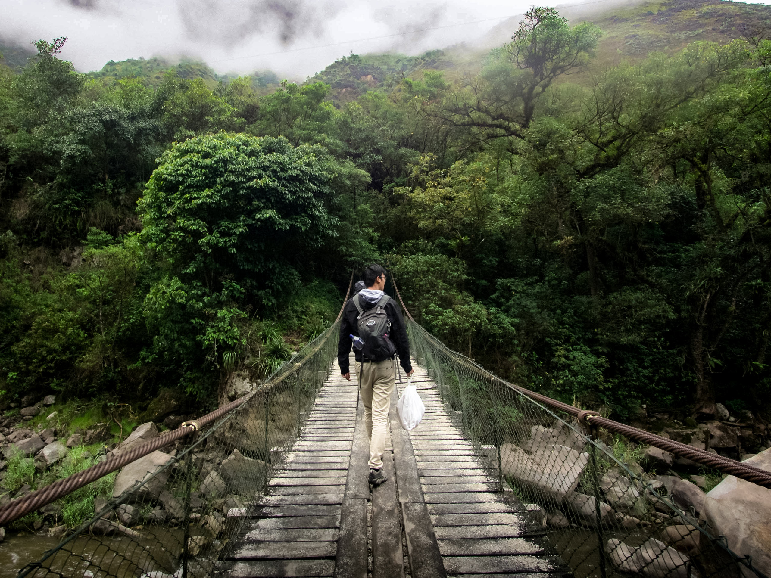 Hiking through jungle across rivers to Machu Pichhu peru