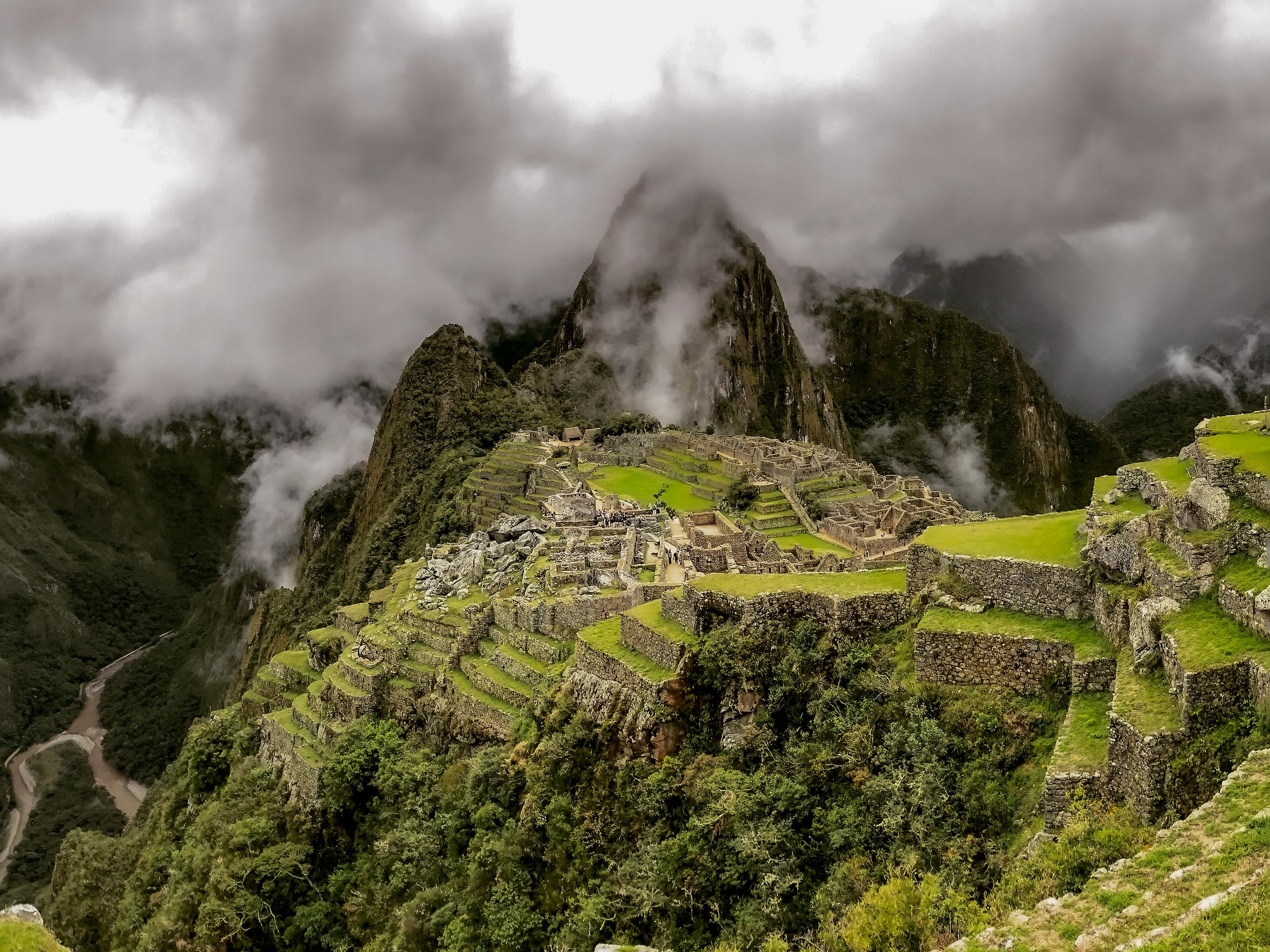 Machu Picchu ancient village through the fog