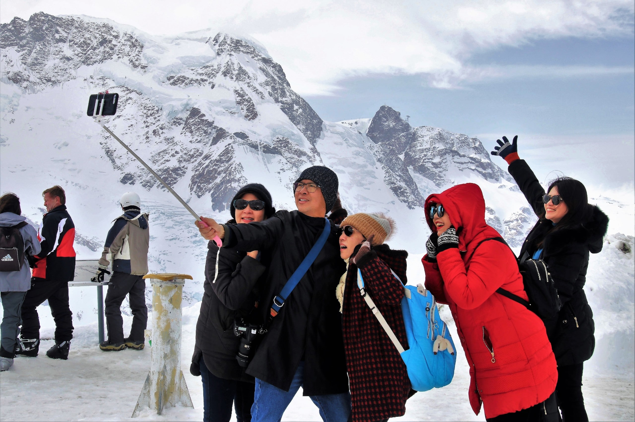 Group of travellers taking a selfie in the mountains